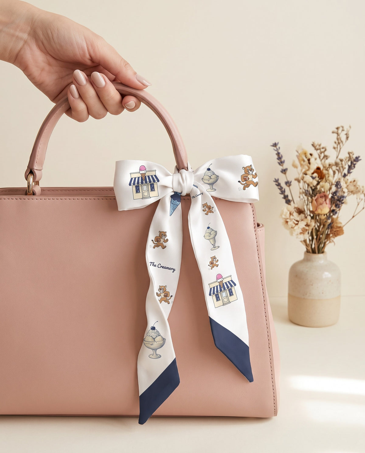 The Creamery Twilly, bow on a top-handle bag